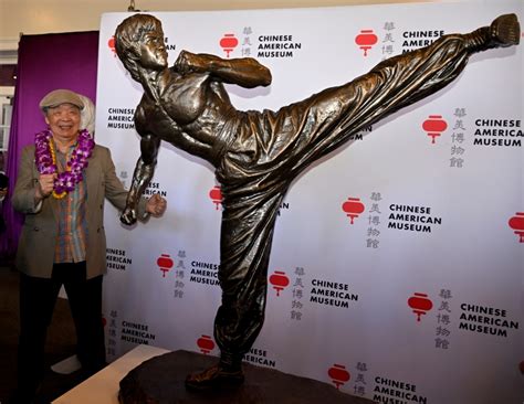 On the 50th anniversary of his death, a life-size Bruce Lee statue is unveiled in L.A.